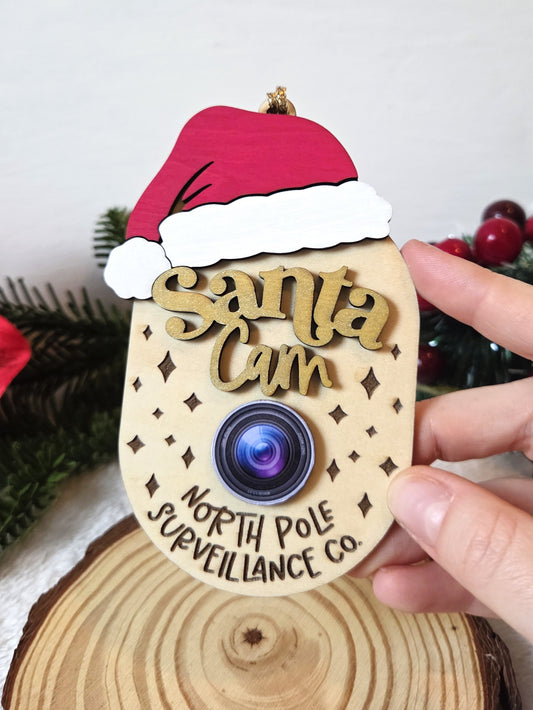 Ornement de Noël – Caméra du Père Noël “North Pole Surveillance Co.” | Santa Cam amusante
